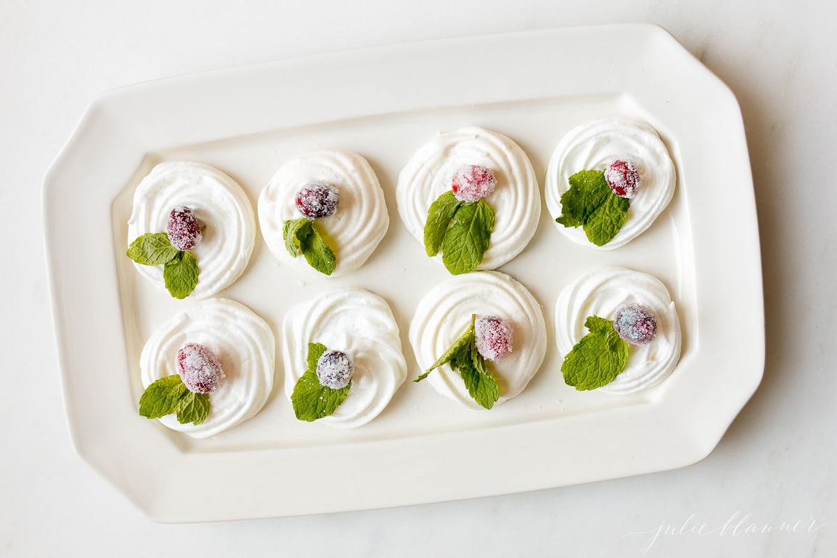 meringue cookies on a white serving platter