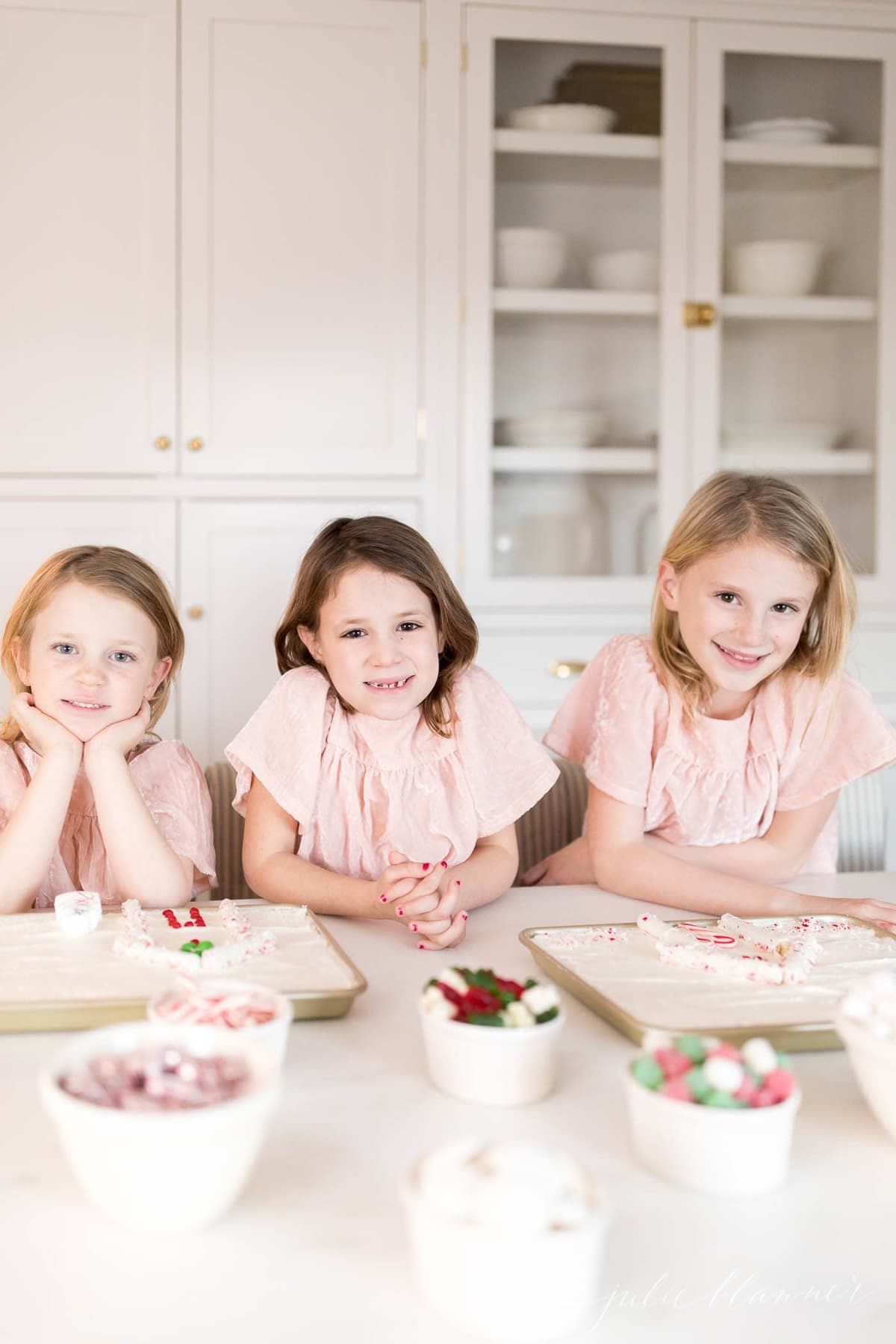 decorating sugar cookie cake as candy houses