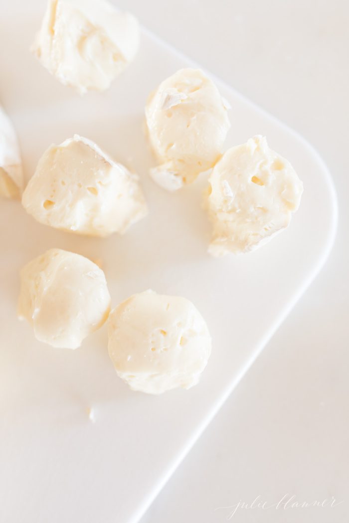 Pieces of cheese on a white plate
