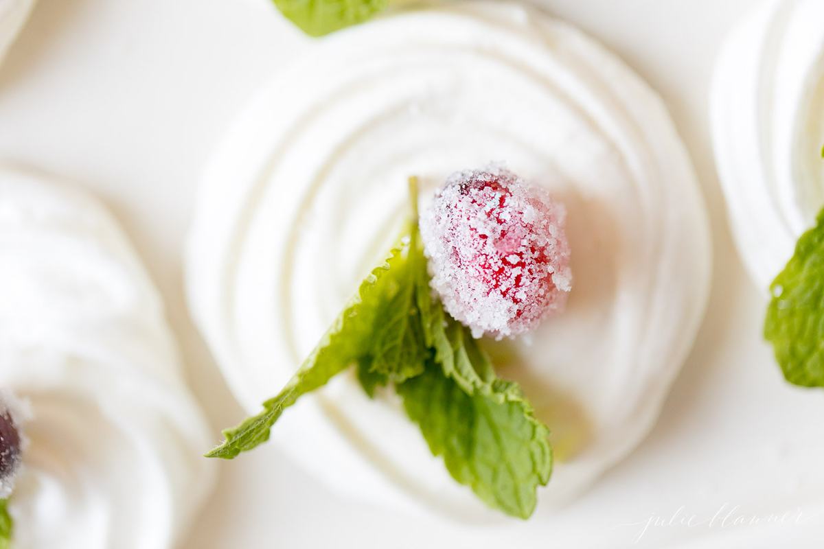 Top down shot of a meringue cookie with garnish