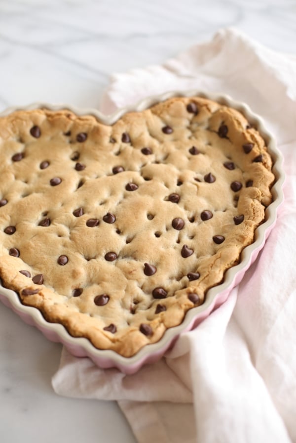 chocolate chip cookie cake in a heart shaped tart pan