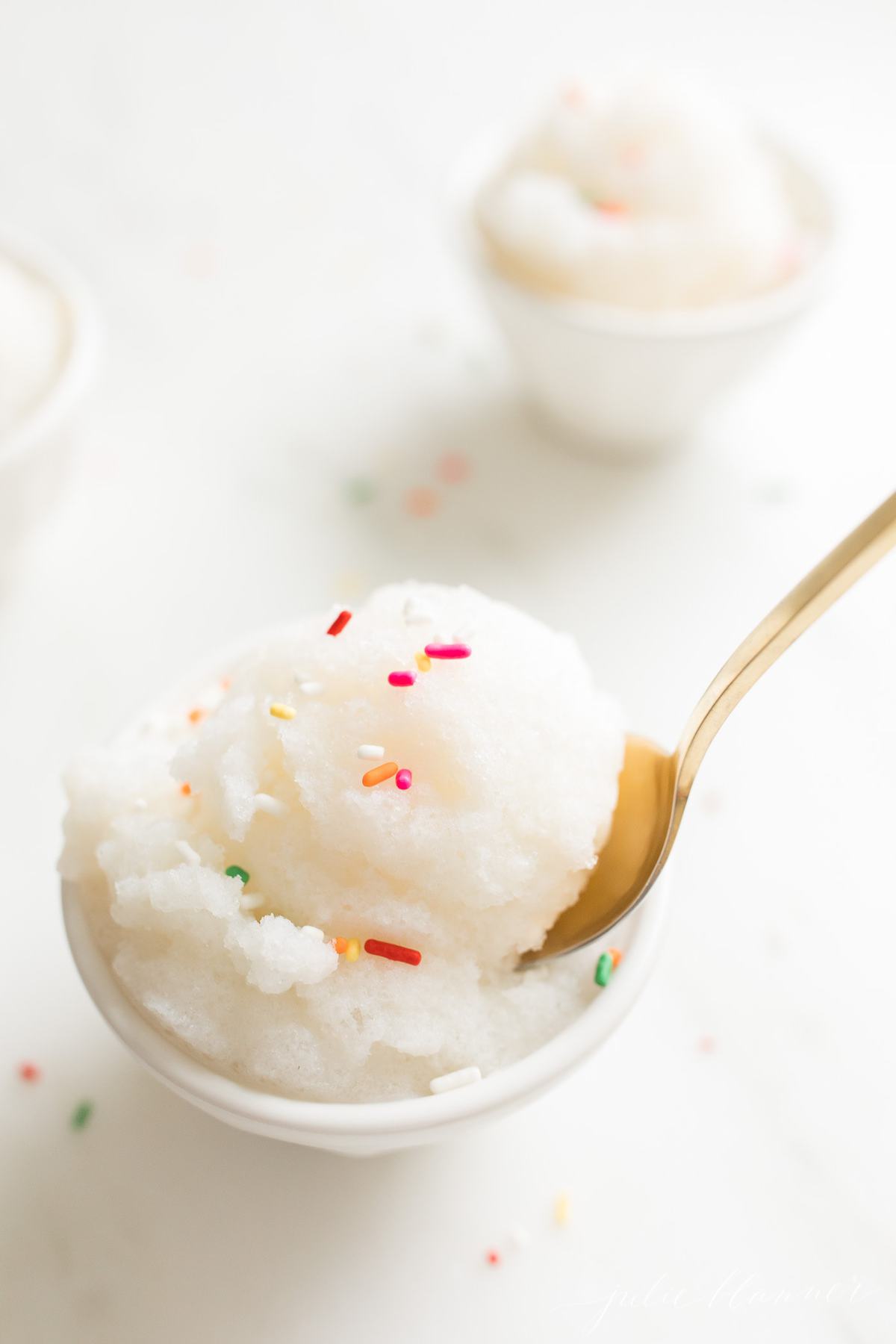 snow ice cream in a bowl with gold spoon