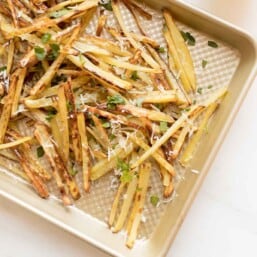 truffle fries on gold baking sheet