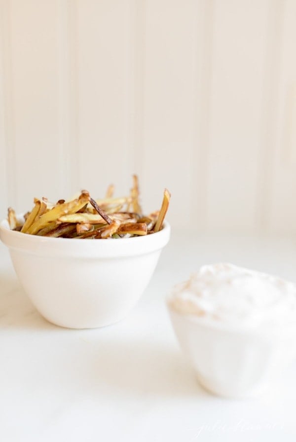 truffle fries in a white bowl