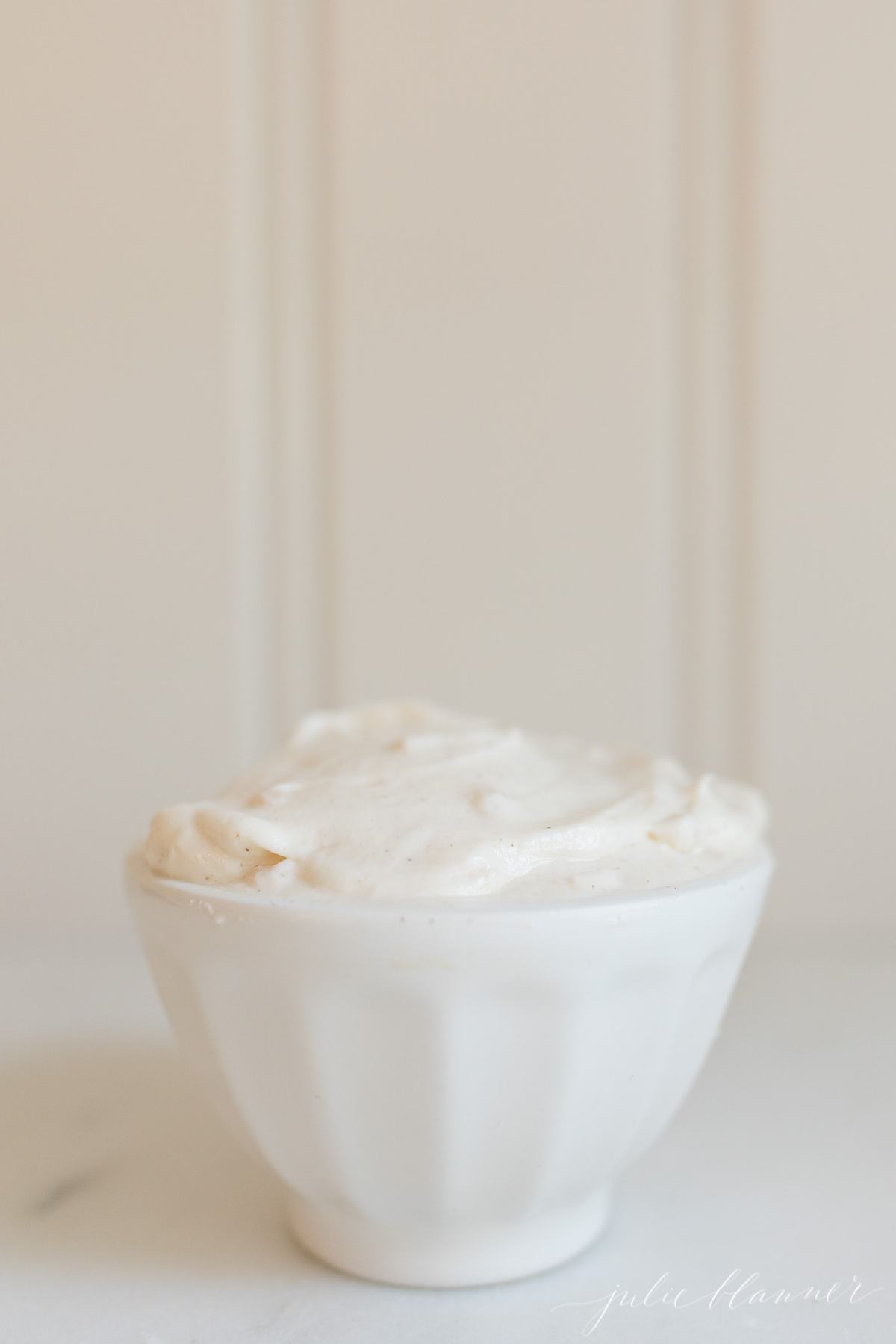 truffle mayo in a white bowl with a white background.