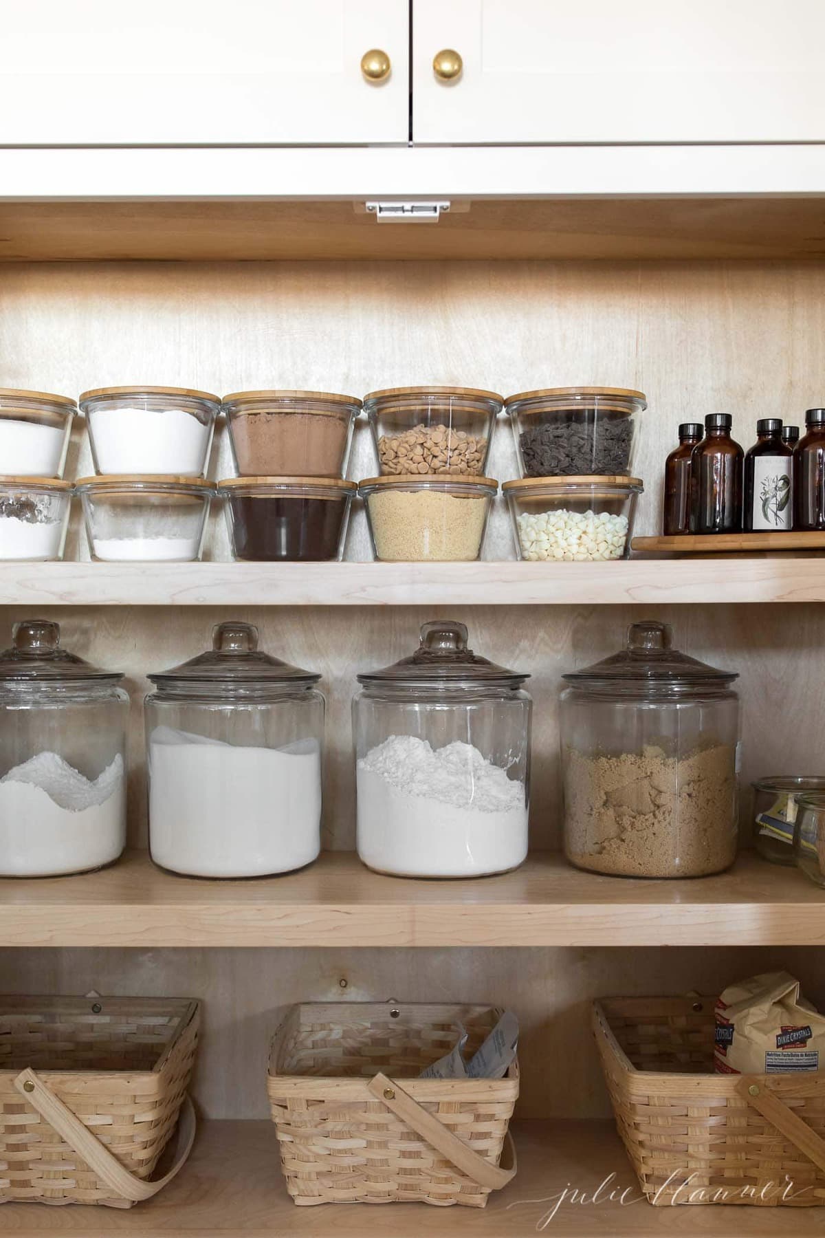 baking cabinet with flour sugar confectioners sugar and brown sugar in jars