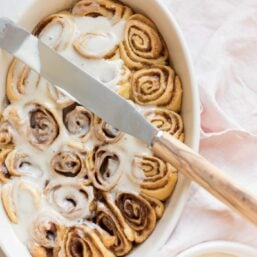 cinnamon roll icing on rolls