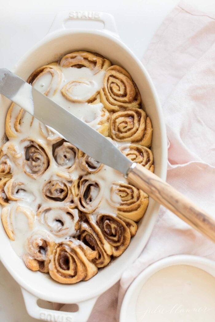 cinnamon roll icing on rolls