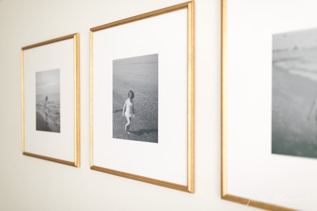 brass photo frames of children on the beach