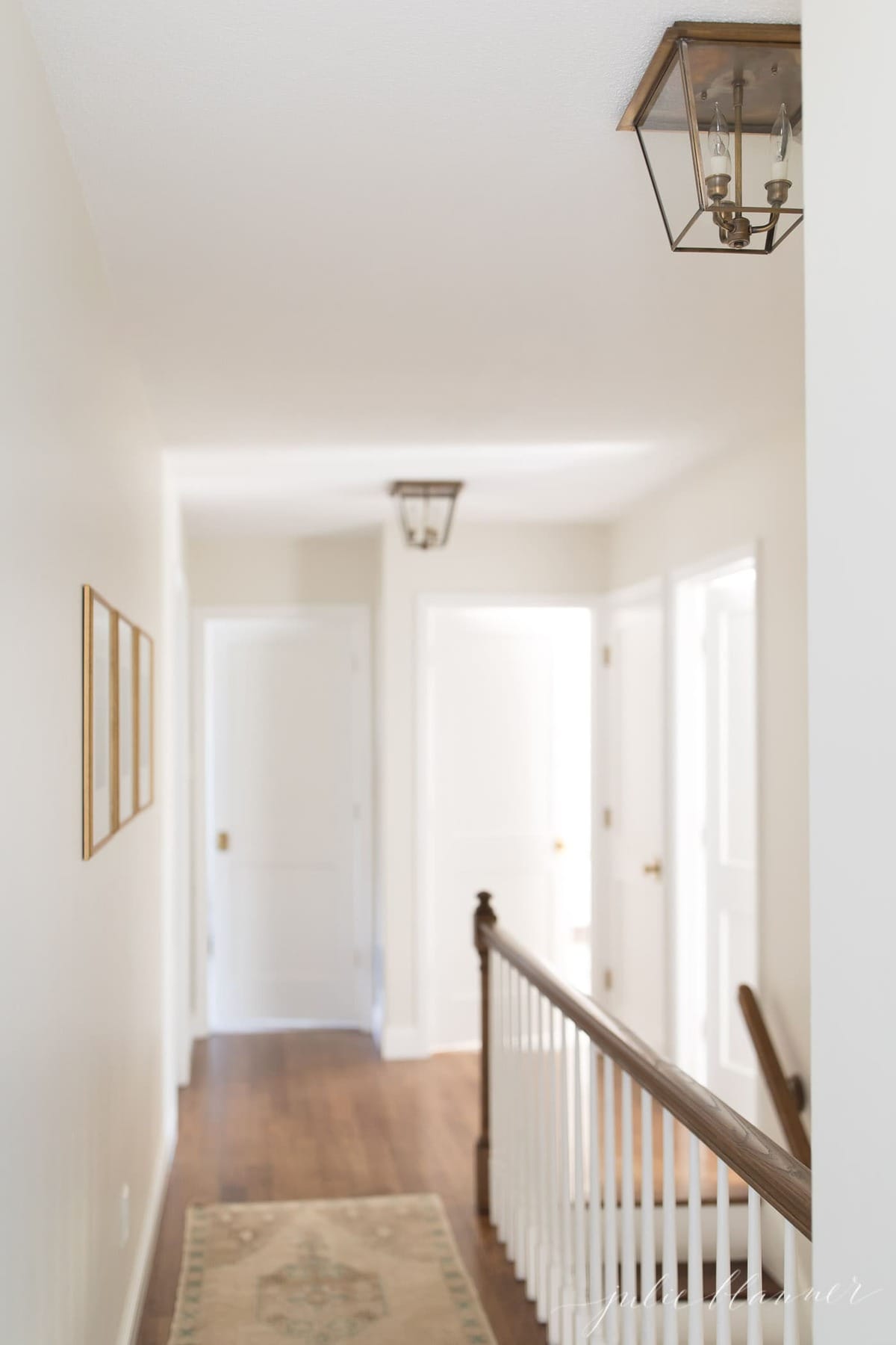 hallway in the upstairs of a home, painted white