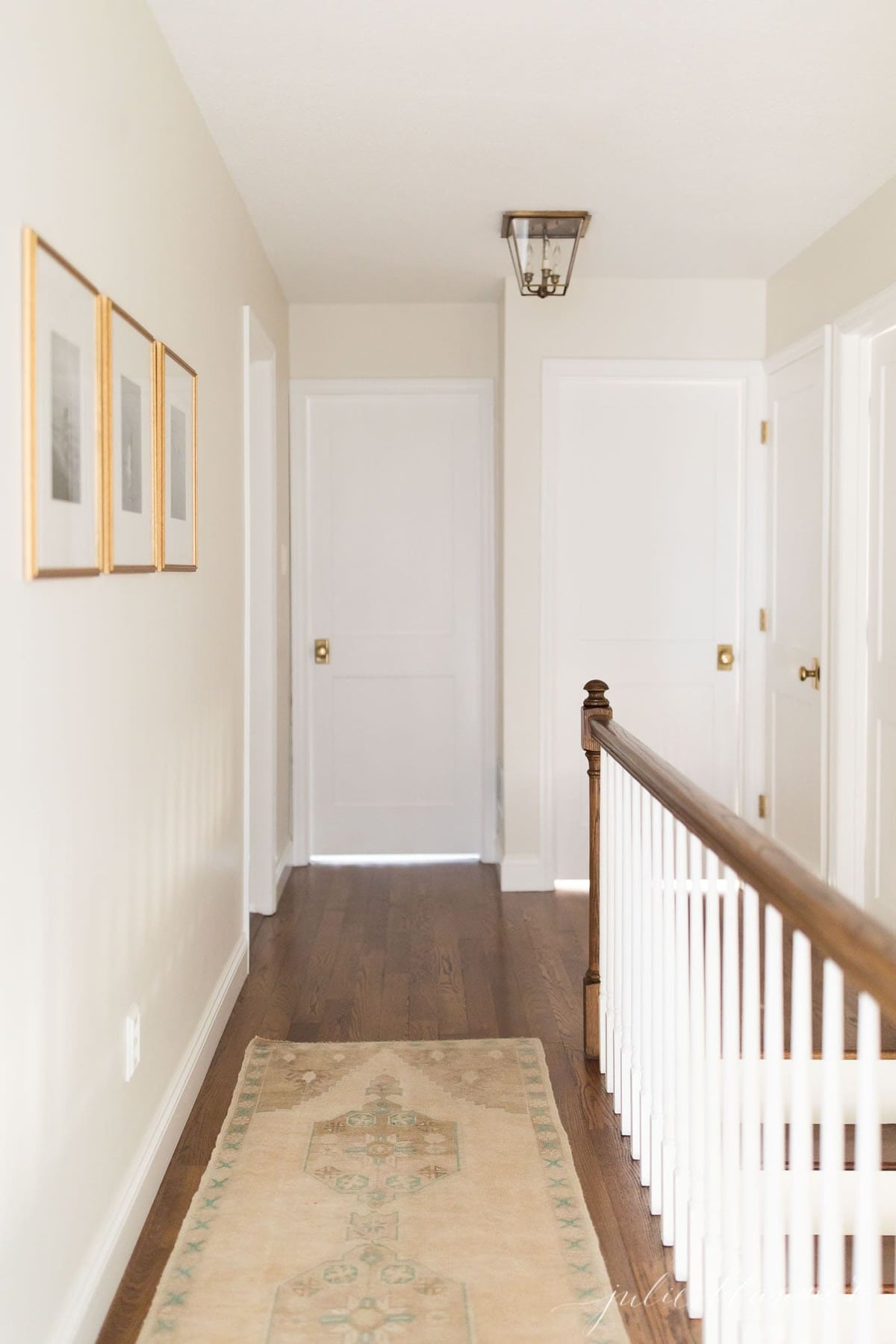 upstairs hallway in a home with a lot of doors