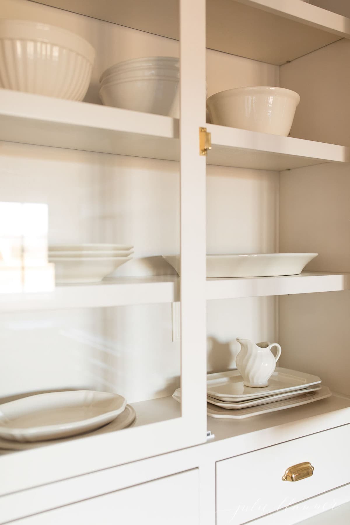 cabinet with platters and mixing bowls