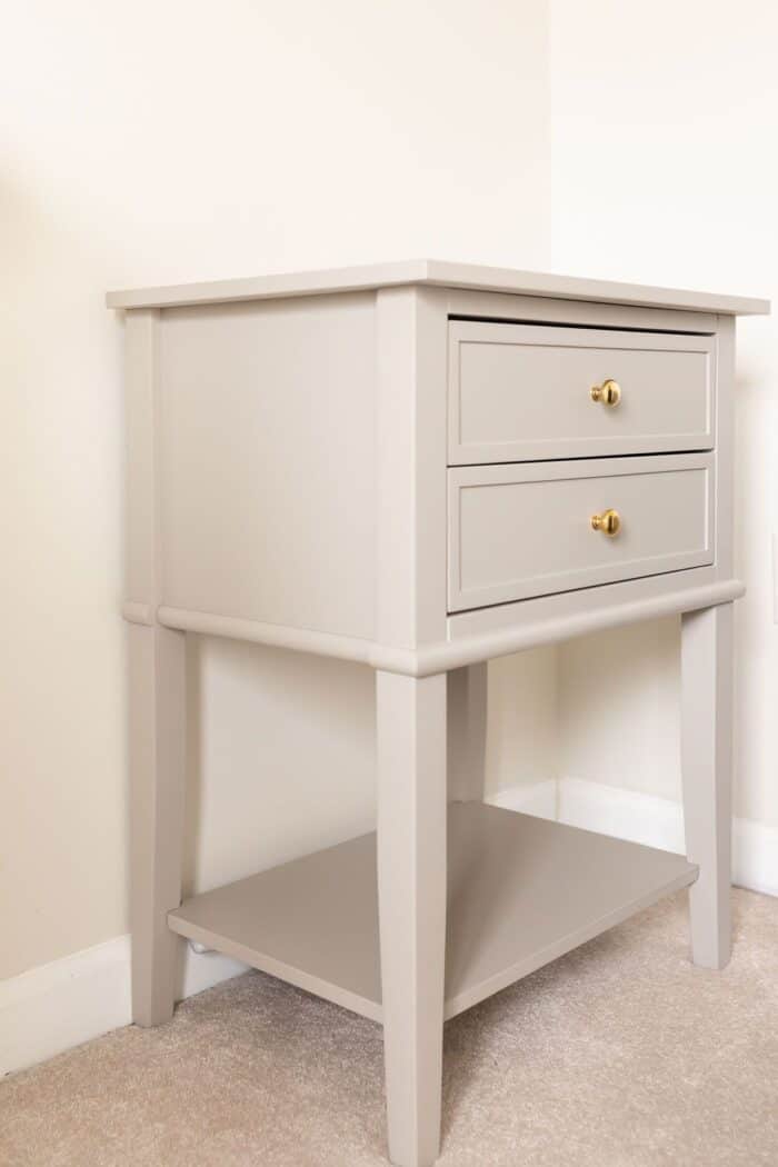 A small gray side table after being painted with a furniture paint tutorial.