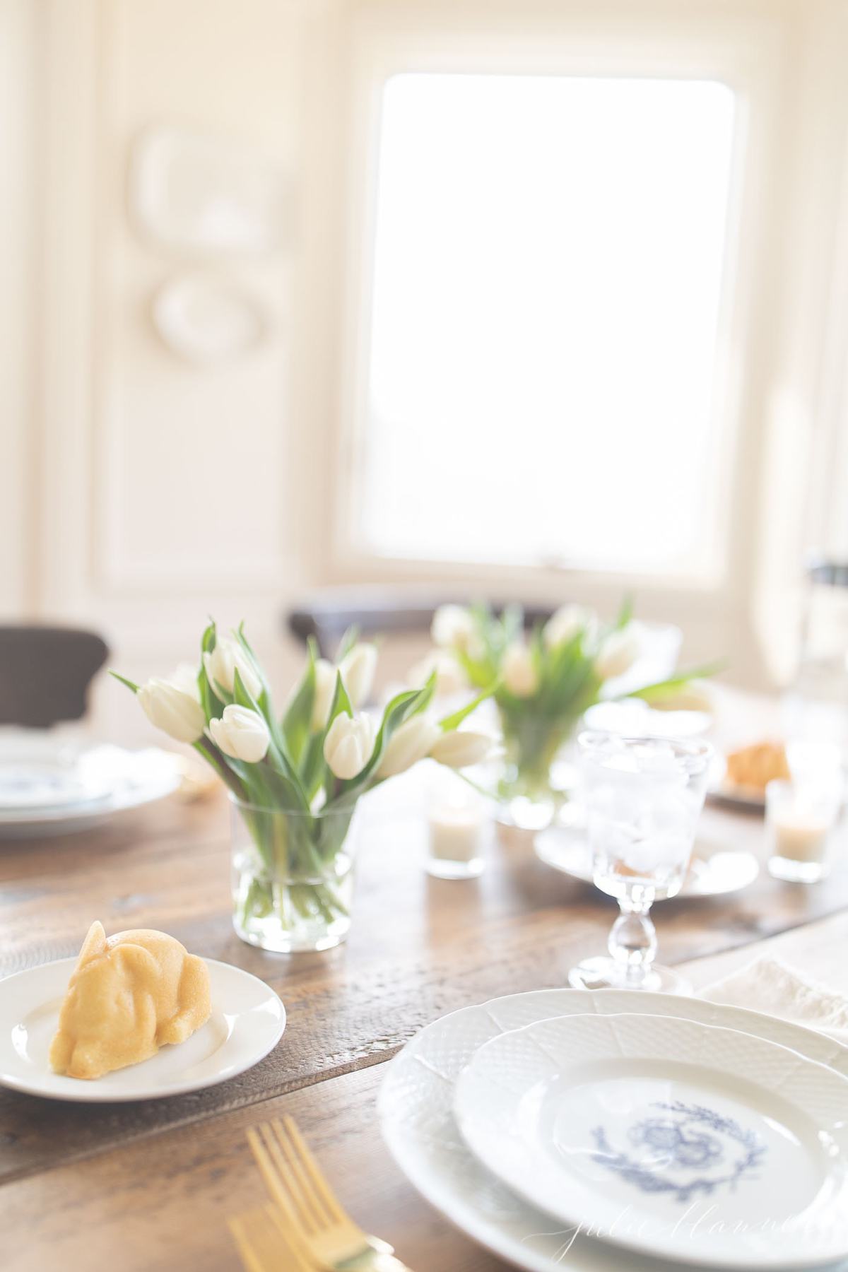 easter cake at each place setting with tulips