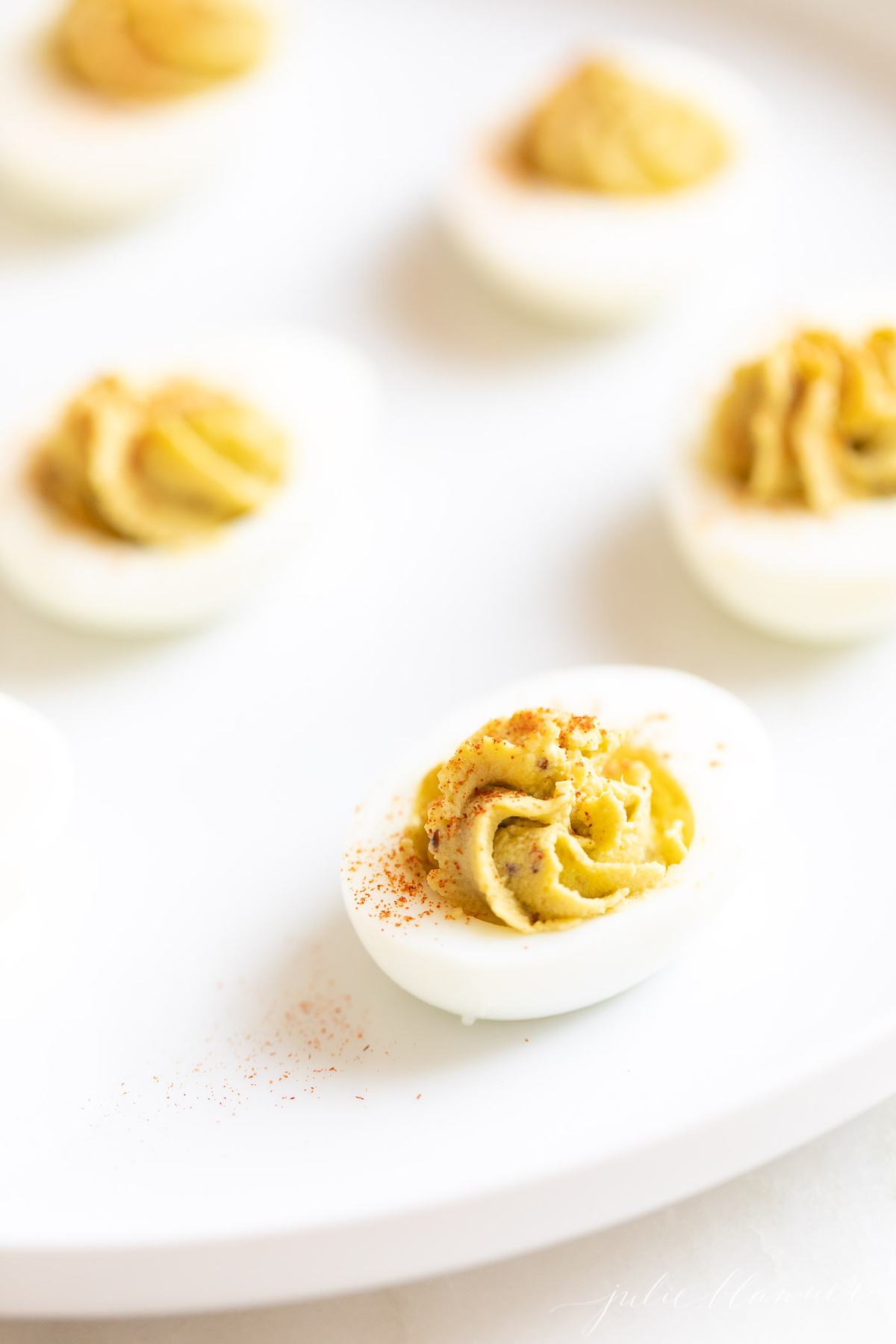 avocado deviled eggs on a platter