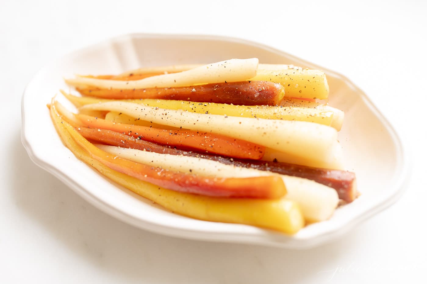 candied carrots in ivory dish