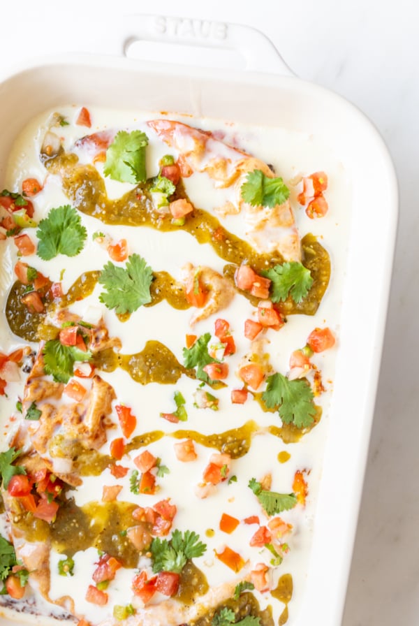 Chorizo burrito Mexican breakfast casserole in a white baking dish.