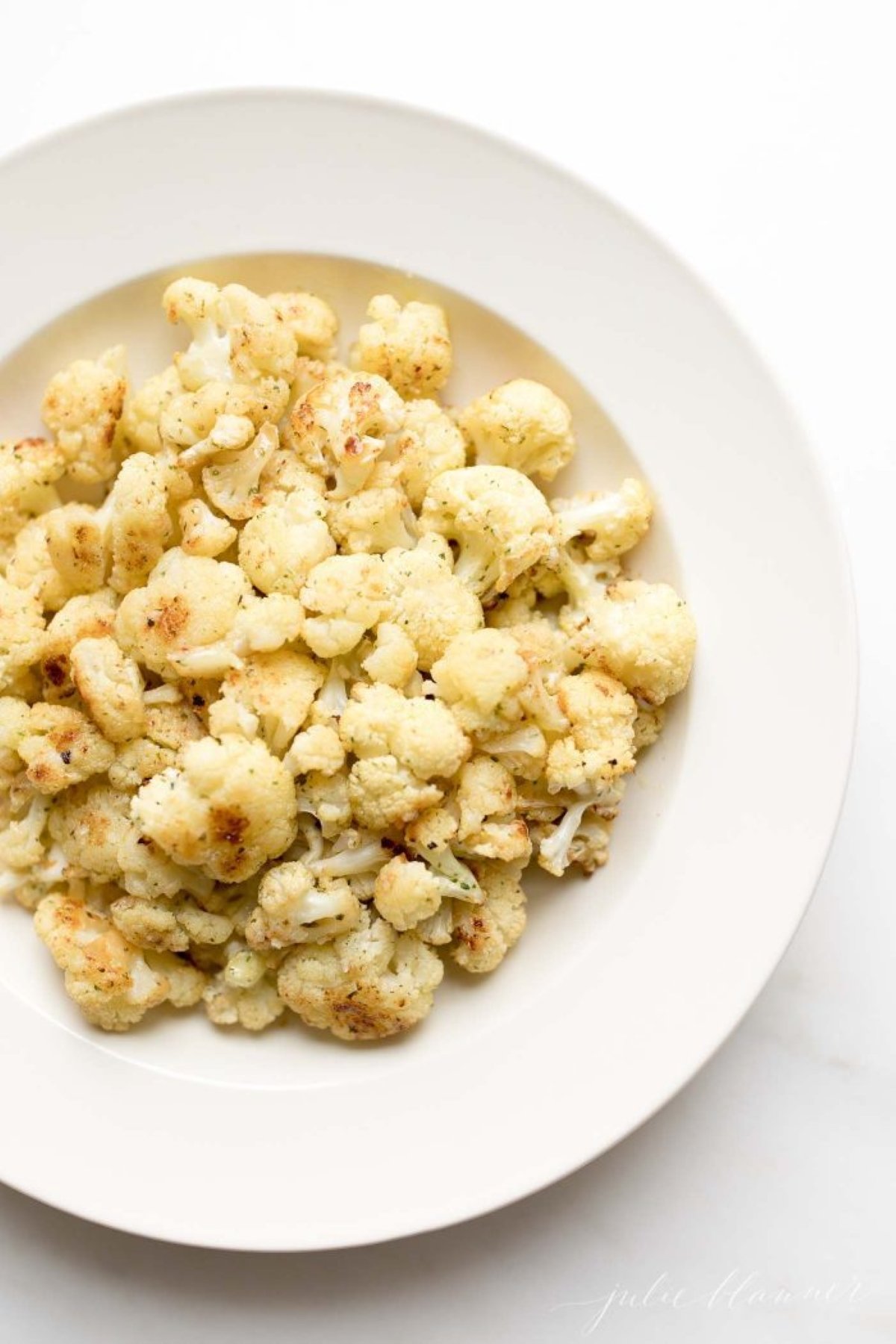 fiesta ranch roasted cauliflower on a white plate