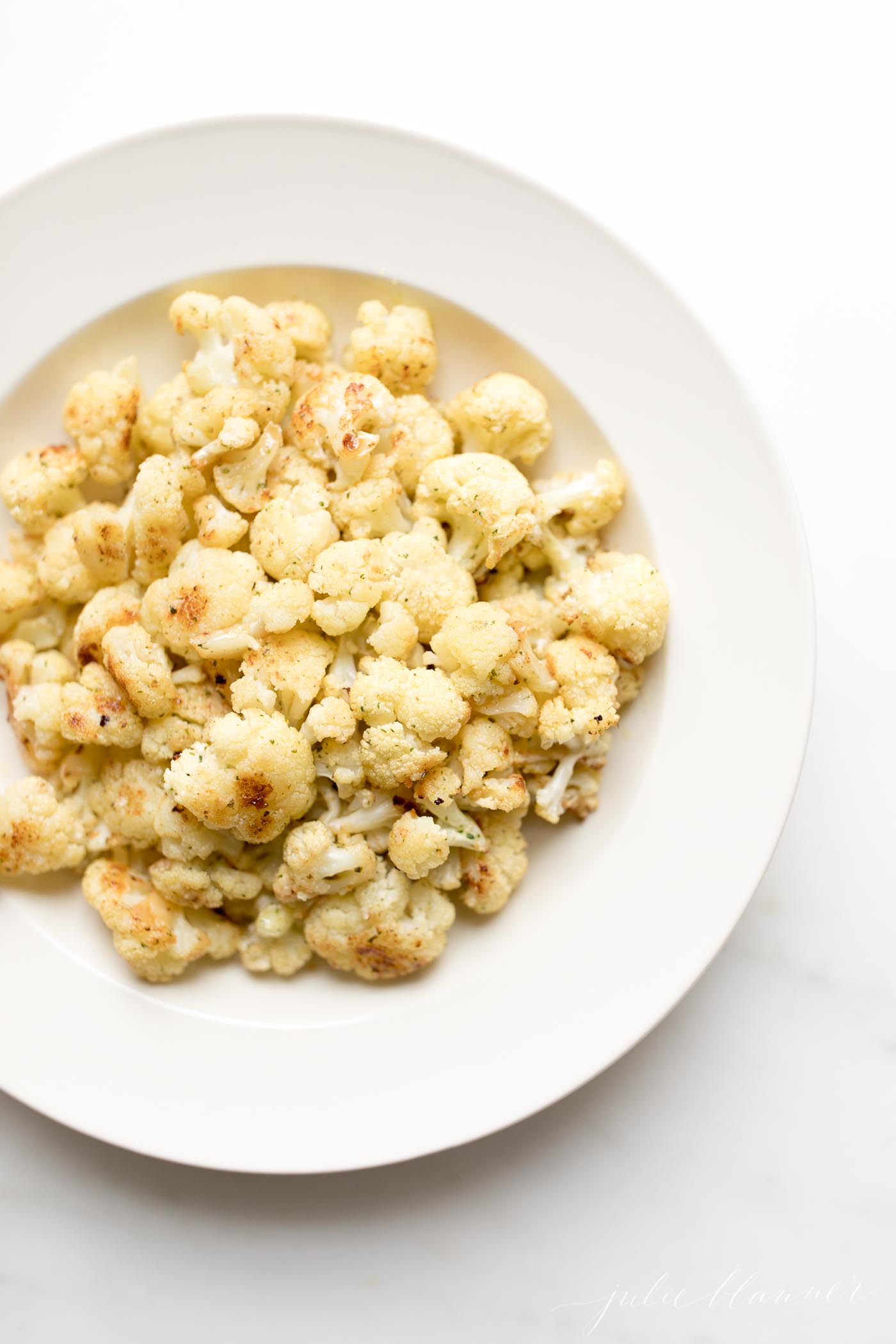 fiesta ranch roasted cauliflower on a white plate