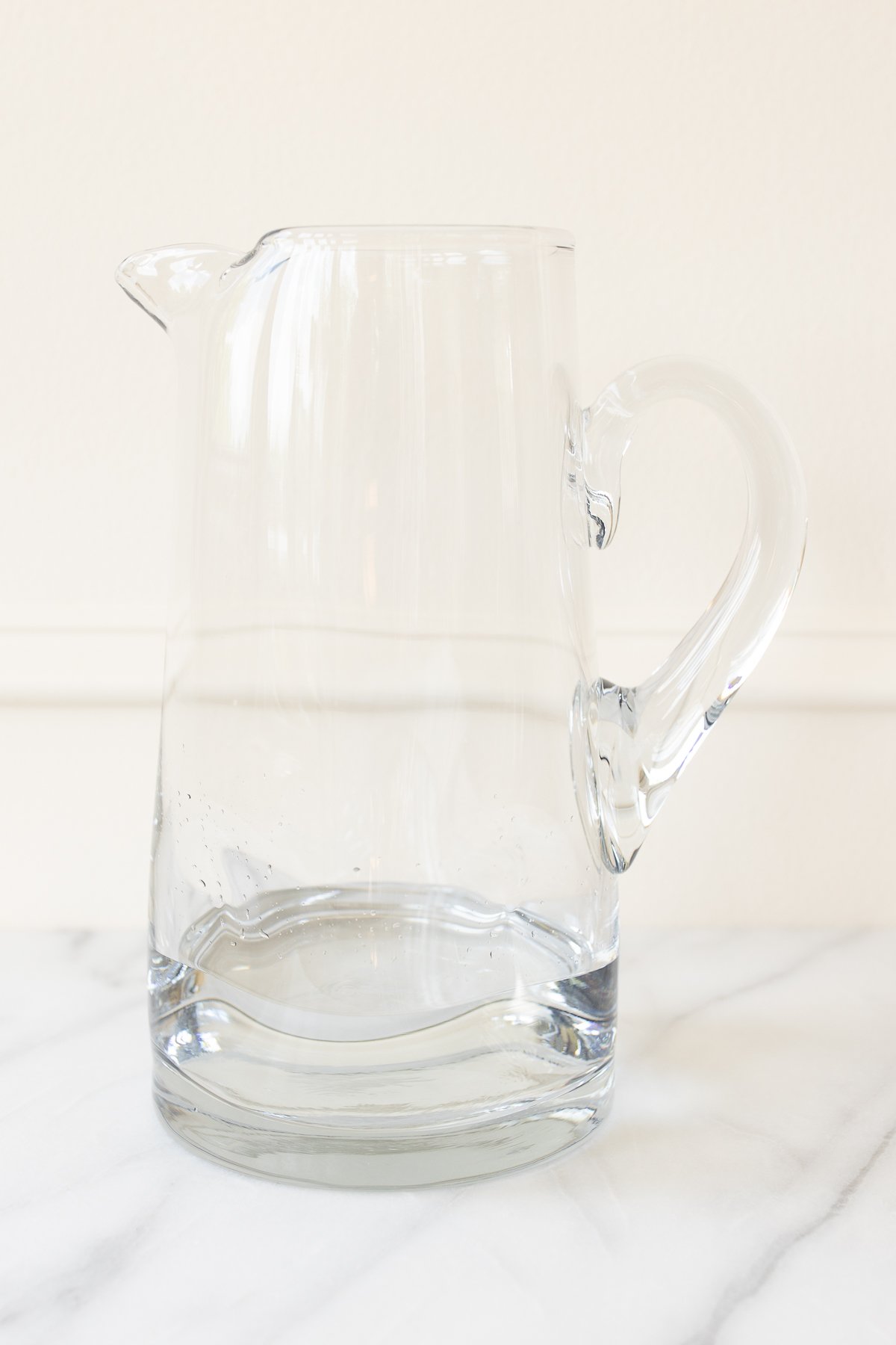 Simple syrup in a glass pitcher.