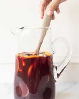 A glass pitcher full of red sangria.