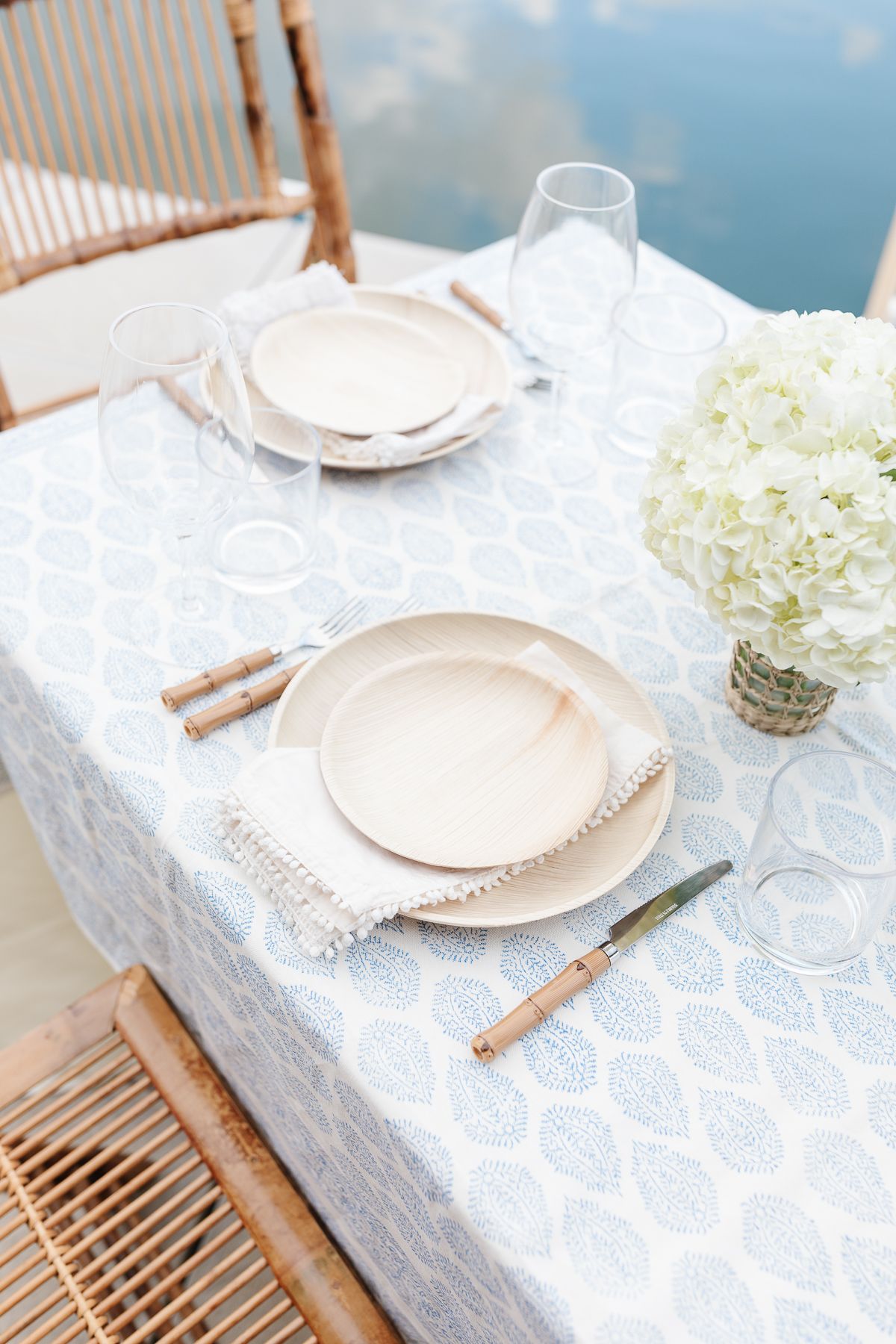 Mother's day brunch ideas with a table set with a blue and white tablecloth and bamboo accents