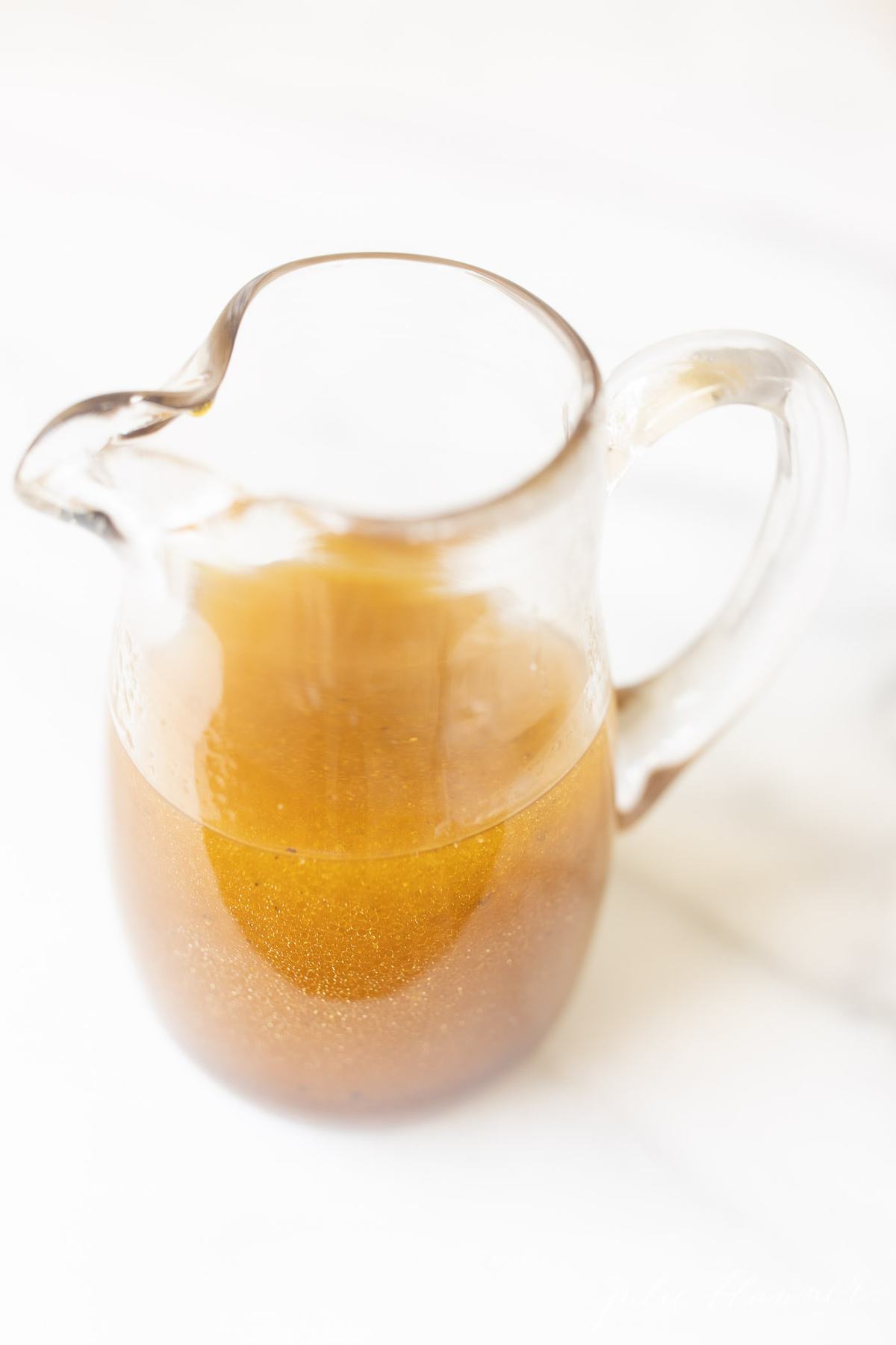 white balsamic vinaigrette in a pourable dressing dispenser