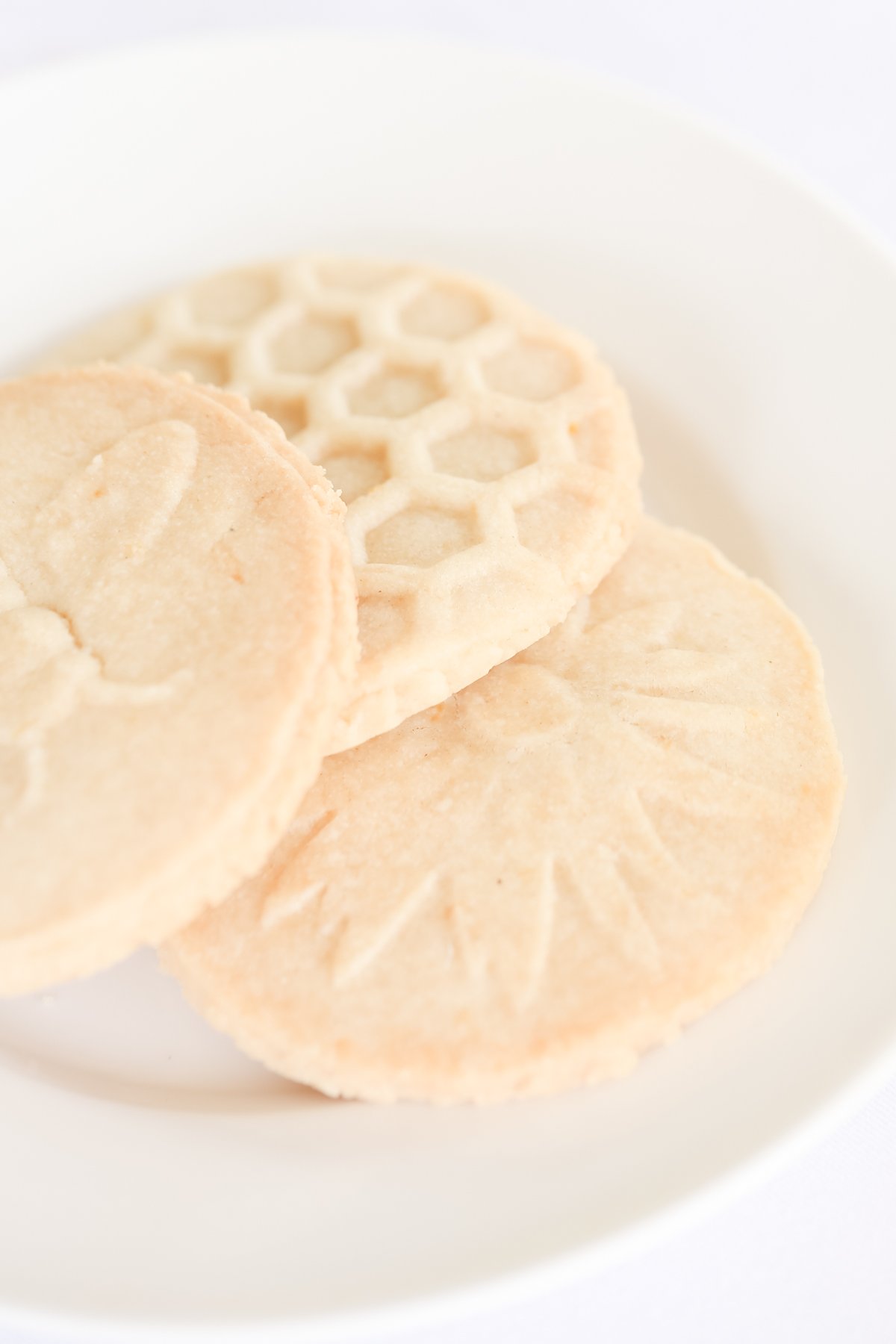 honeycomb stamped lemon shortbread cookies on white plate