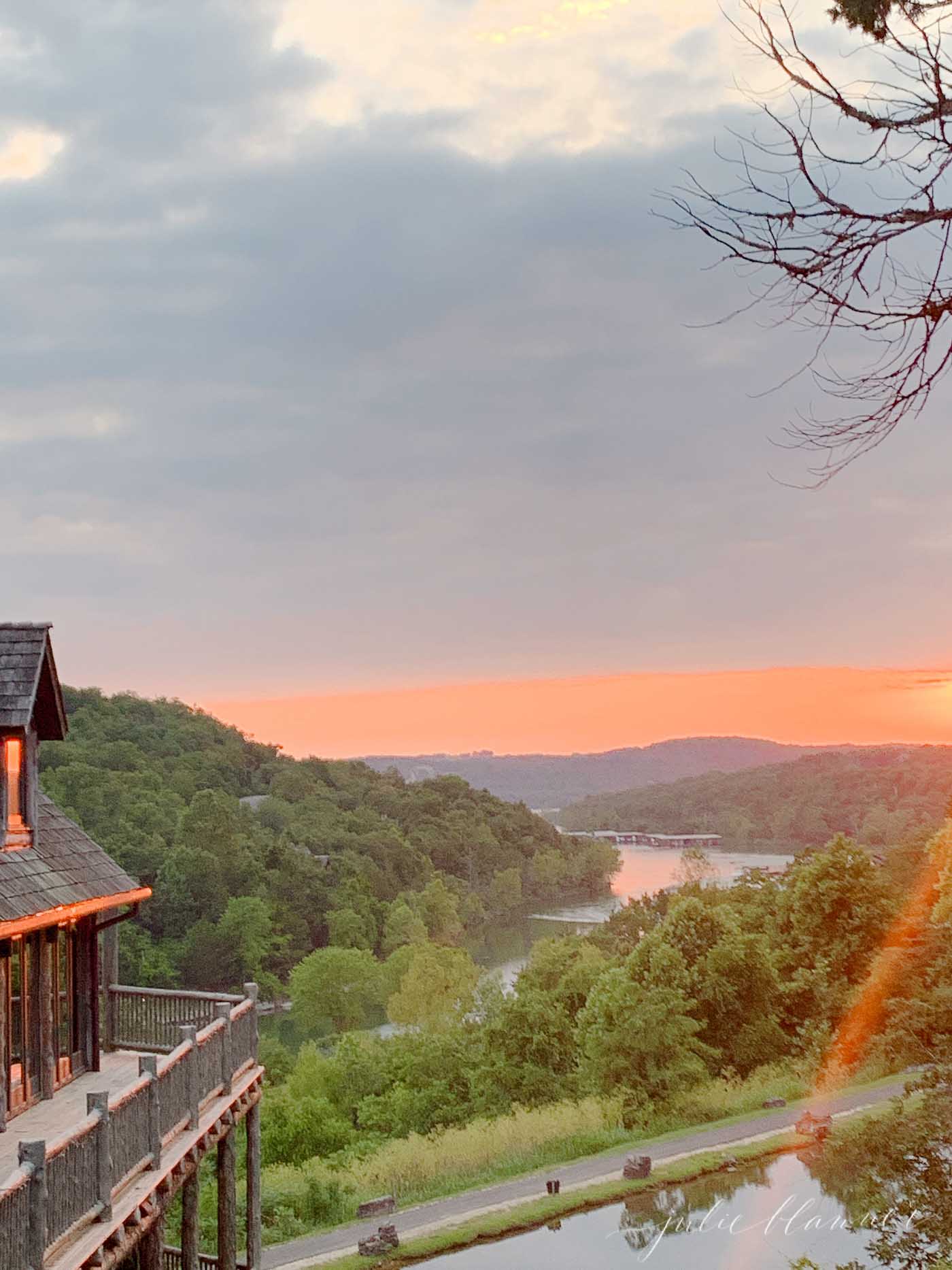 view of table rock lake sunset from devils pool restaurant at big cedar