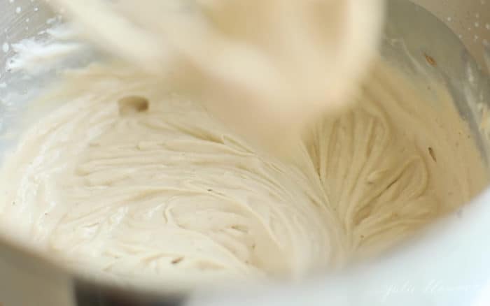 blending cookie butter and sweetened condensed milk into heavy cream