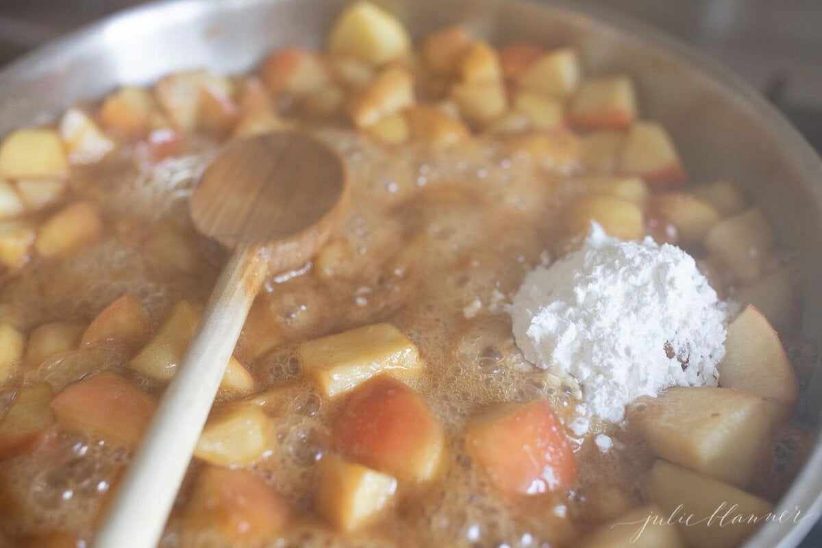 Apple crisp topping cooking in a pan on a stovetop