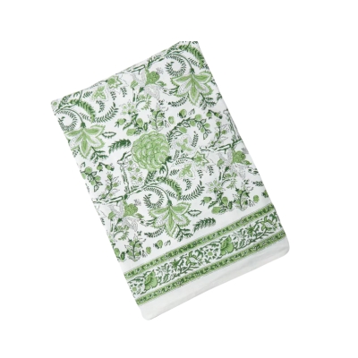 A green and white paisley block print tablecloth