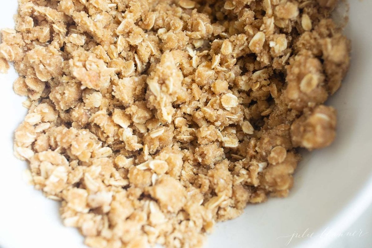 Oatmeal topping mixed up in a white bowl