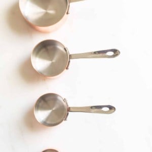 measuring cups on a marble surface