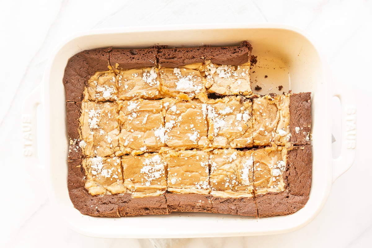 A peanut butter ooey gooey butter cake in a white pan.