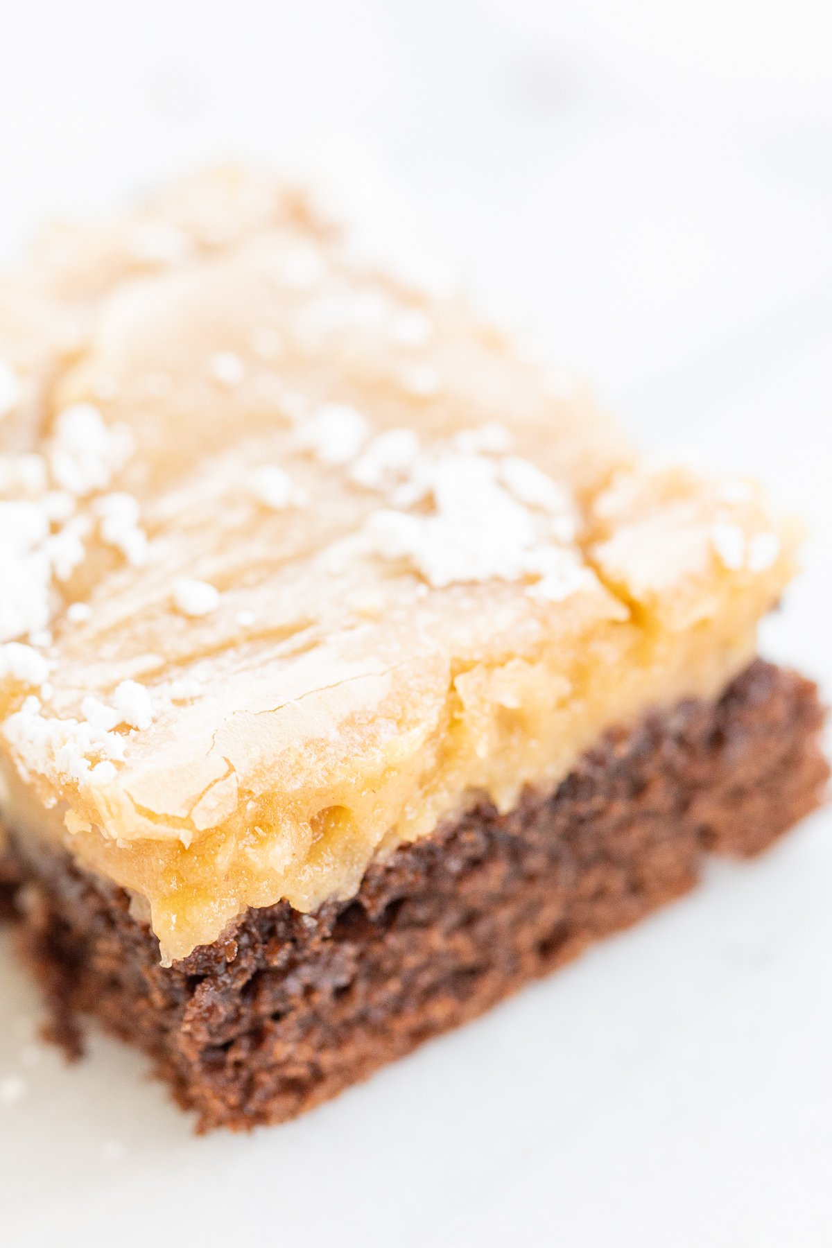 A slice of peanut butter ooey gooey butter cake.