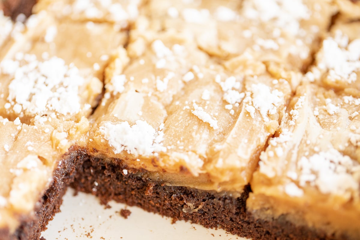 A peanut butter ooey gooey butter cake in a white pan.