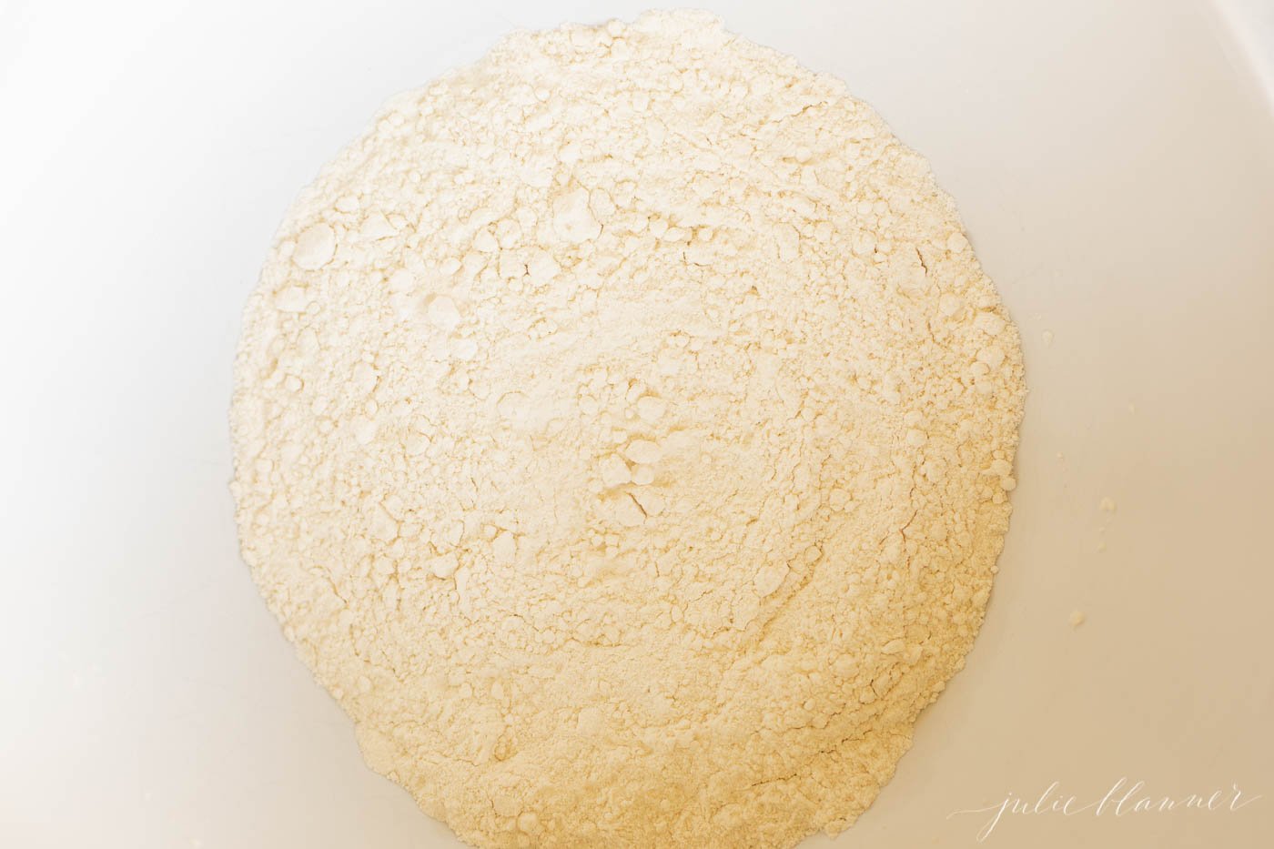 A bowl of flour ready for a speculoos cake or cookie butter recipe.