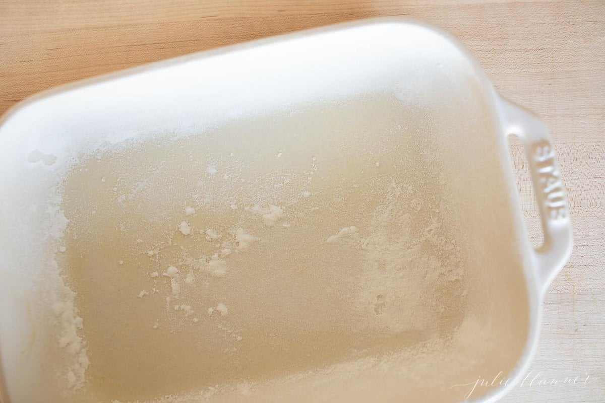 A white baking dish filled with speculoos cake.