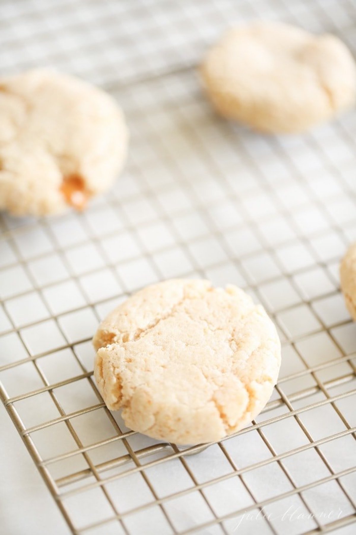 Cheesecake cookies on a wire cooling rack