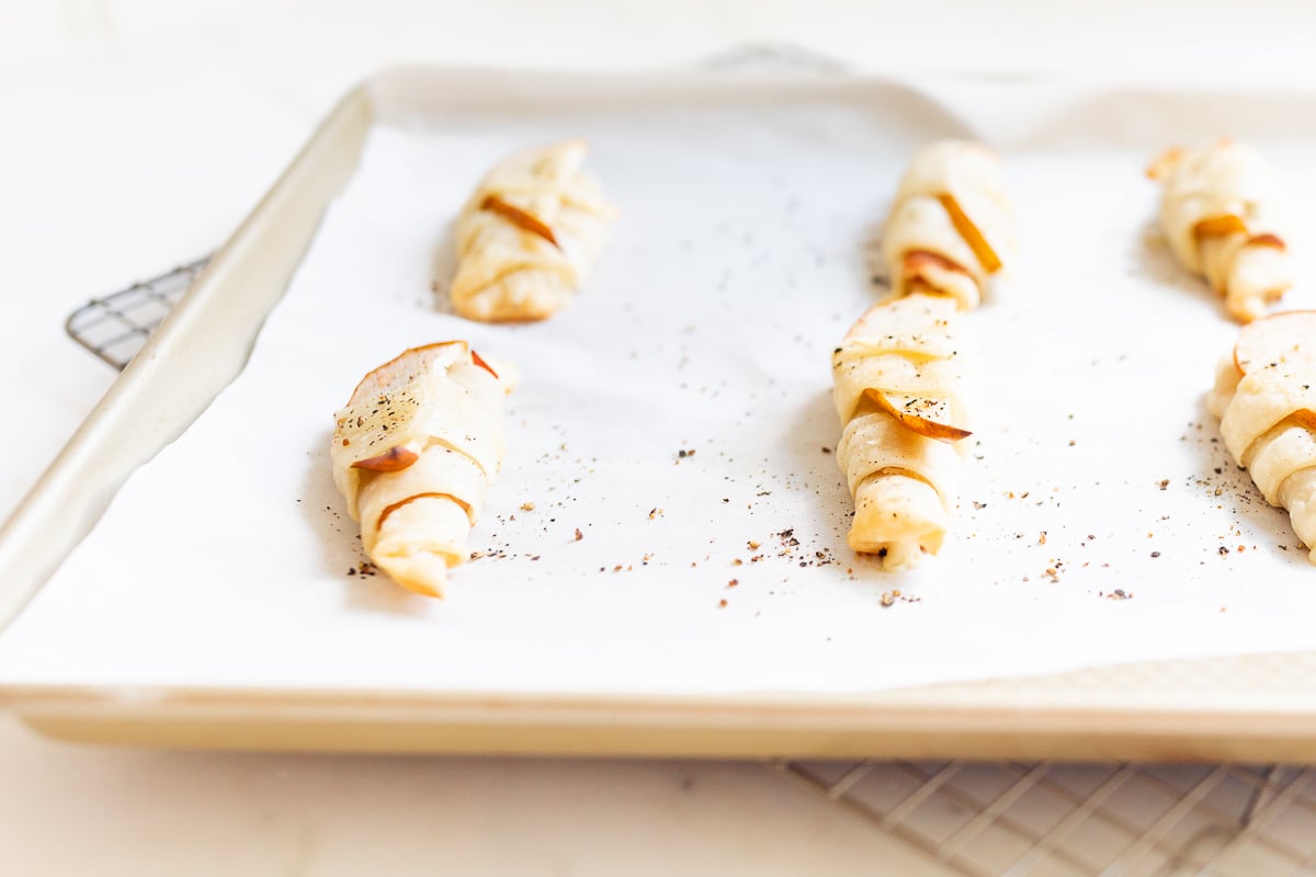 A baking sheet with a tray of apple cinnamon streusel, perfect for appetizers using crescent rolls.