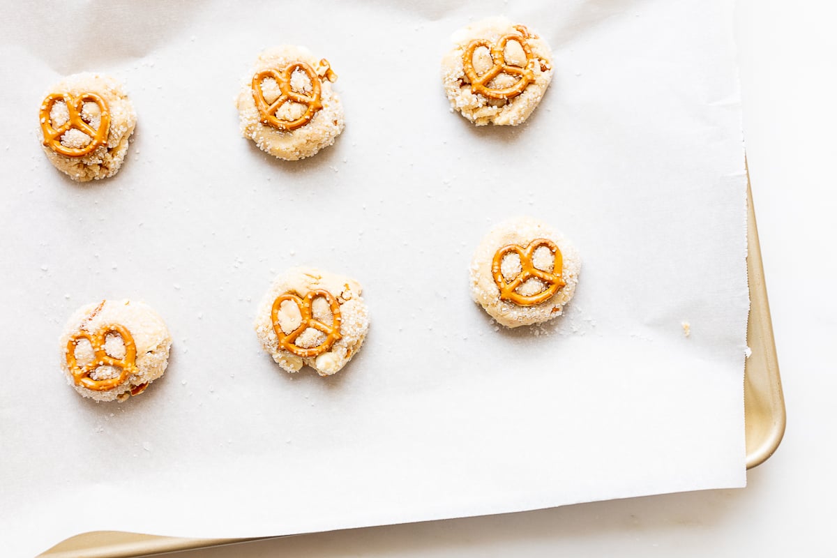 White chocolate chip cookies on a baking sheet.