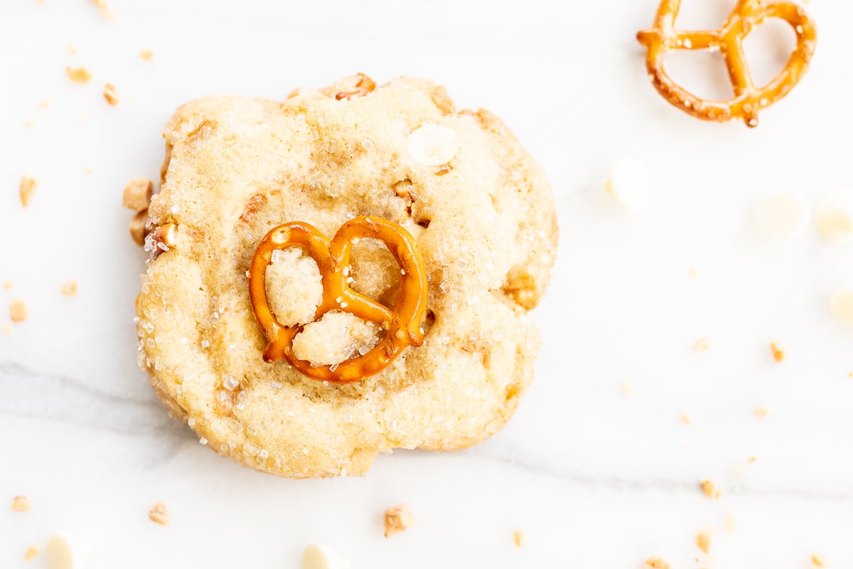 Kitchen sink cookies with pretzels, white chocolate and toffee on a marble countertop