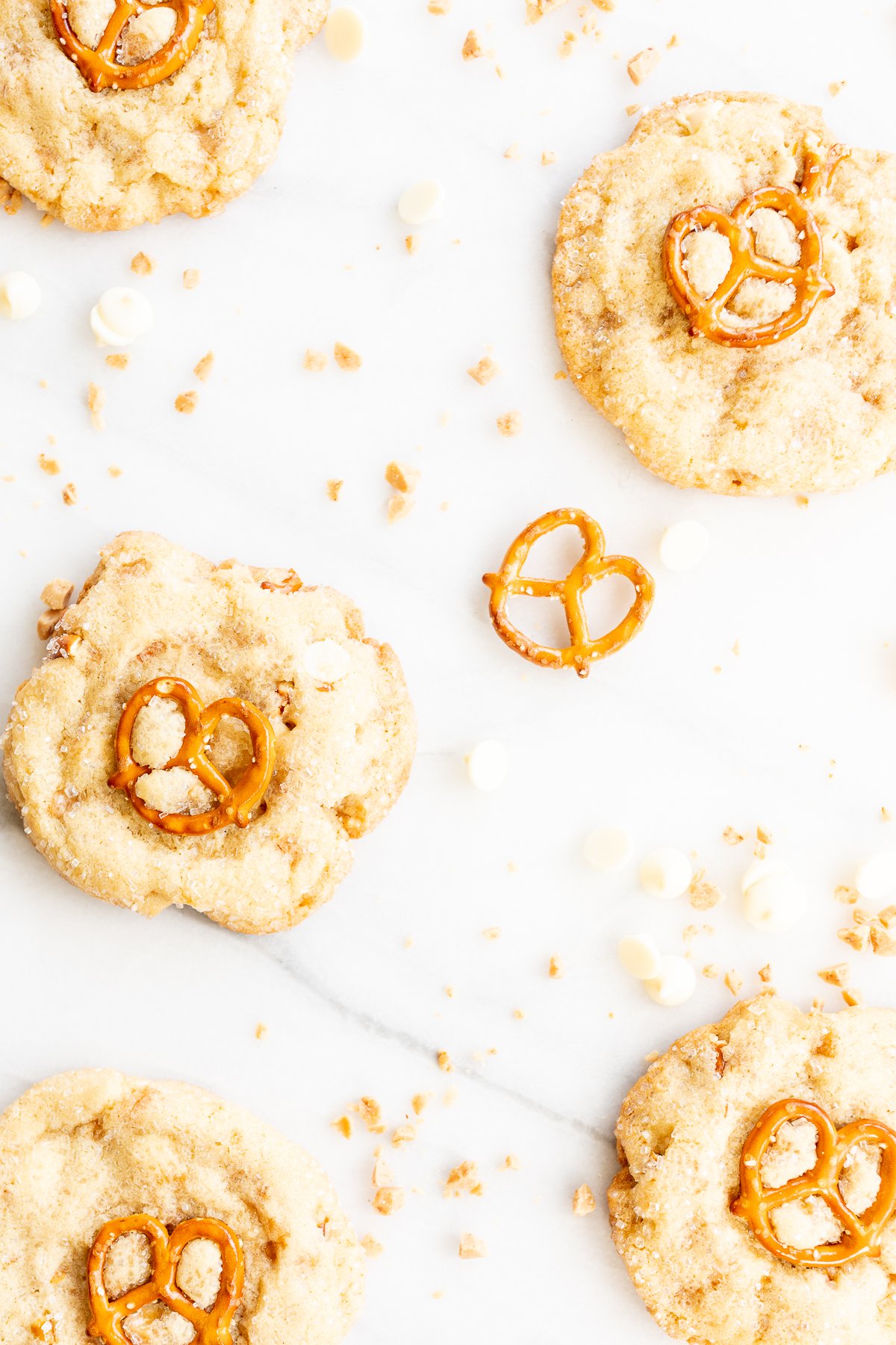 Kitchen sink cookies with white chocolate chips on a marble table.