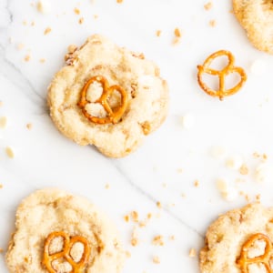 Kitchen sink cookies with pretzels, white chocolate and toffee on a marble countertop