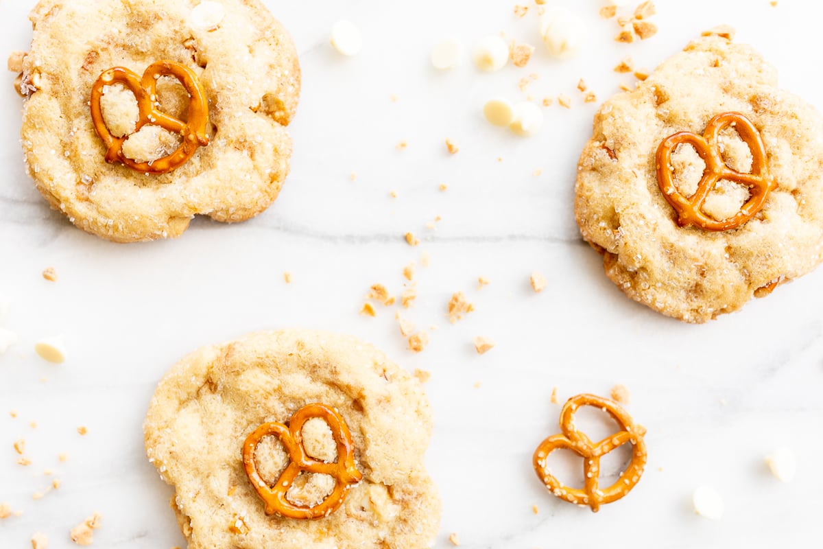 Kitchen sink cookies with pretzels, white chocolate and toffee on a marble countertop
