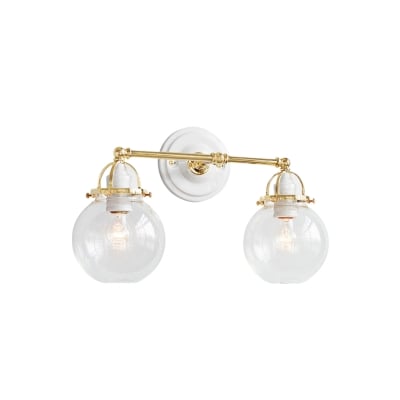 a nautical bathroom light fixture with glass globes