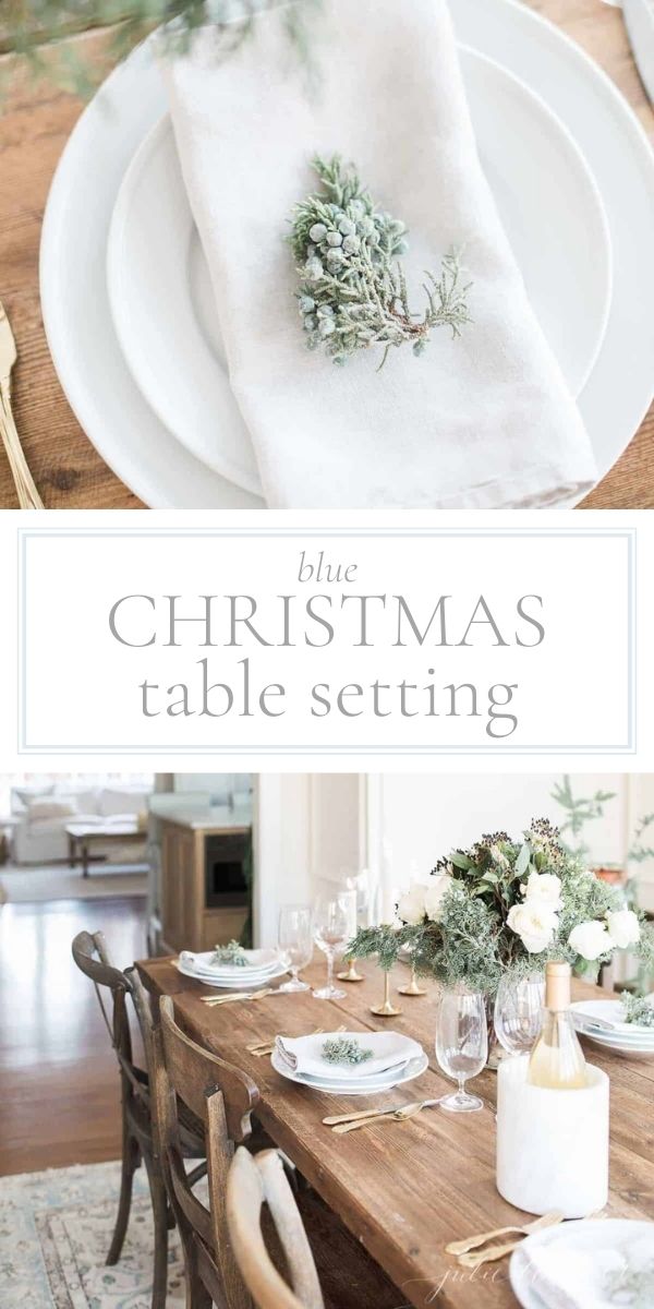 A christmas table setting with white plates and silverware.