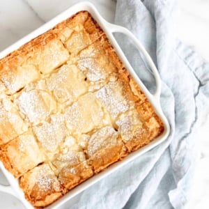 A white baking dish with a gooey butter cake.