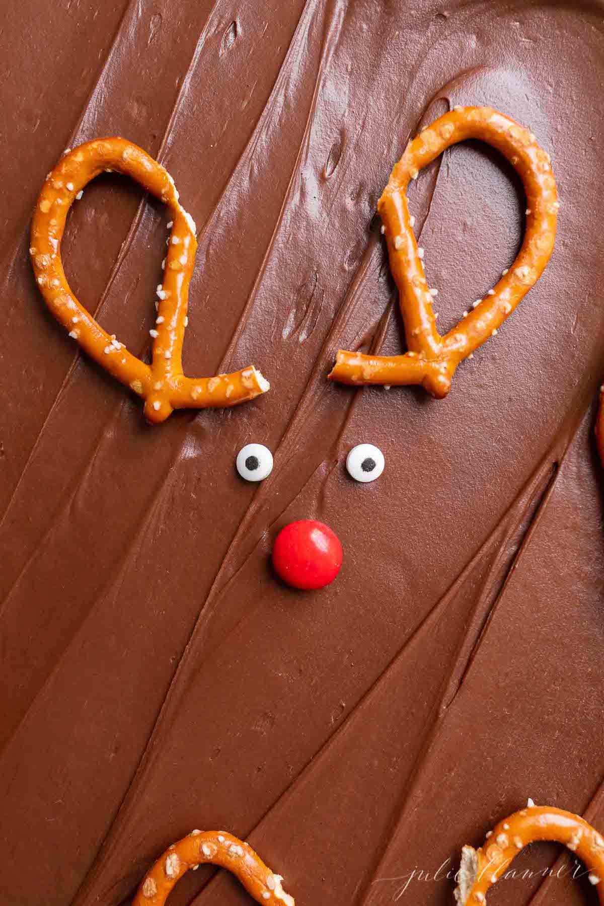 Christmas brownies with pretzels shaped into reindeer.